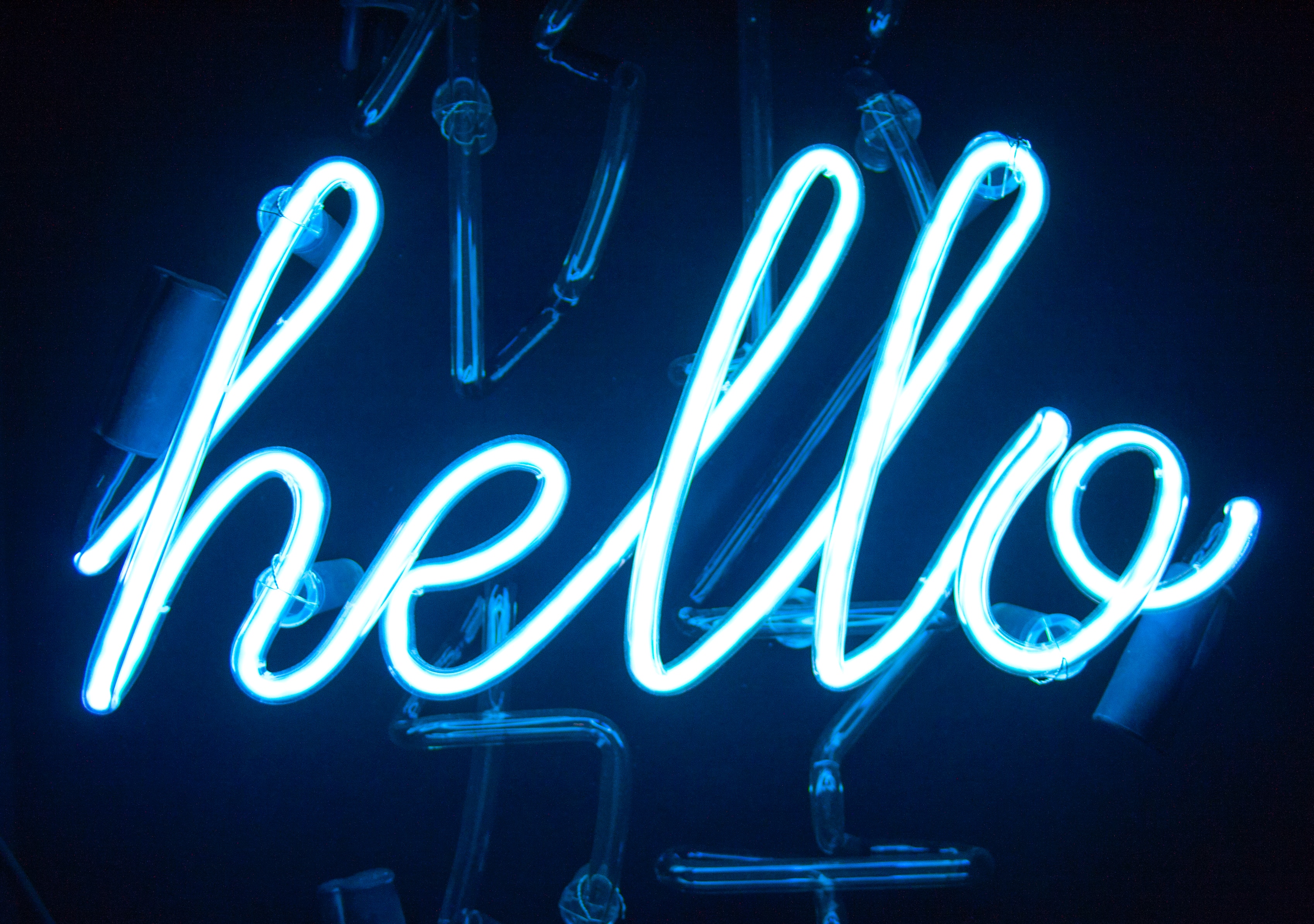 Photograph of neon light saying hello by Pablo Gentile via Unsplash