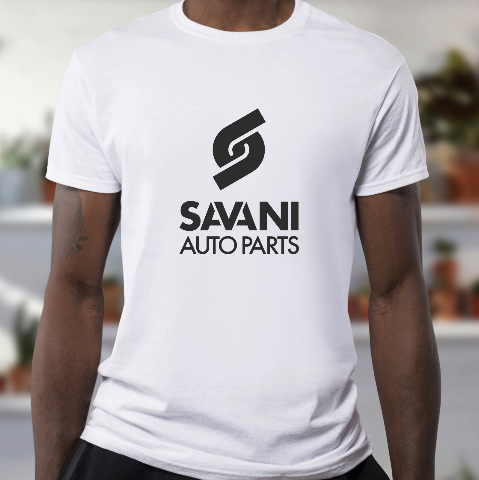 A t-shirt with the Savani Auto Parts logo mark and type logo
